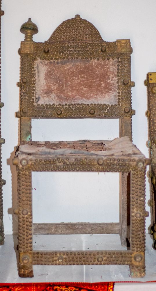 A brass-studded asipim chair with a cast finial, from the Akropong collection