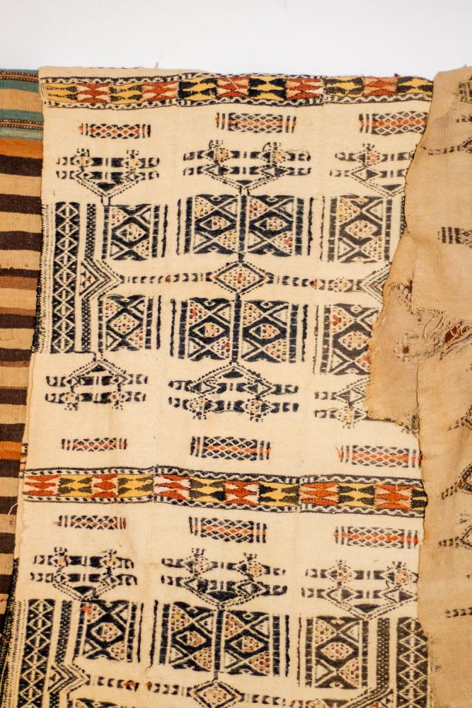 Hand-woven cloth panels with black and ochre diamond motifs